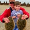 Grandpa and grandson, Doyle and Tanner landed these 18 and 19 inch flounder on berkley gulp.