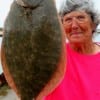 Barbara Singleton of Winnie, TX wtrangled up this 22 inch flatfish on berkley gulp.