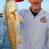 Larry Bar of Houston hefts his 25 inch red caught on live shrimp.