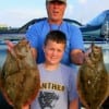 Fishin Buds Robert Falk and Caden Hamppon of Anahauc, TX display their 21 and 22 inch flounder caught on berkley gulp.