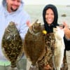 Wade-anglers Becky and Mike Godfrey of League City, TX worked finger mullet for these flounder and speck.