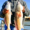 Desmond Turner of Houston nabbed these two slot reds fishing shrimp.