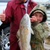 Grandpa and grandson- Proud gramps Curtis Howard of Huntsville TX gives a thumbs up to Mason Beard of Mexia TX for his very first redfish caught at Rollover Pass on shrimp.
