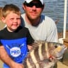 Father and Son, Mark Barfield and 5yr old Hunter show off their 20 inch sheeps head caught on live shrimp.
