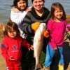 Mother and  daughters,Three cuties help mom.  Brenda Pereira of Richmond, TX show off  her 28 inch red caught on shrimp.