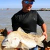 Gary Hust of Beaumont,  TX wrastled this HUGE drum in on shrimp, then released it.