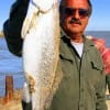 Port Bolivar angler  holds an 8 lb Ed Snyder speck he caught and released while fishing soft  plastics