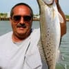 IMG_0040- Port Bolivar angler  Don Kernan displays this 27inch- 8.5 lb speck he caught on a soft  plastic- then released her-