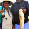 Frankie Edwards praised the LORD for this 27inch redfish her hubby Clarence is holding.