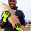 Catching his very first redfish at rollover.  Edward Richardson of Houston took it on shrimp.
