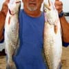 James Fontenot of Alvin, TX nabbed these two nice specks fishing plastic.