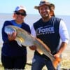 IMG_0036- Alyssa and Andres Olivarez of Houston tackled this 36inch tagger bull red while fishing shrimp-