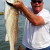 Donald Post of League City, TX hefts this 37 inch tagger bull red caught on a mud minnow.