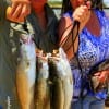 Susan and Mike English of Zavalla, TX heft these nice schooly specks caught on Saltawter Assasins.