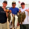 Jasonand John Manning teamed up with Henri Fontenot of Dallas wade-fishing Rollover bay with Berkley Gulp for these fine flounder.