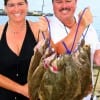 Angelina and Louis Rodriguez of Old River, TX waded Rollover Bay with finger mullet and berkely gulp for this double limit of flounder.
