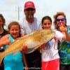 The Gang of Five group of Elysian Fields, TX display their 40inch tagger bull red they caught on a miss nancy croaker.