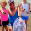 Kelleen Lout of Lufkin, TX spent quality time with daughters 8yr old Harlie and 4yr old Preslie catching hermit crabs at the pass.