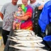 Granpa Felix with Daughter Chelsie and grandaughter 9month old Taylor with Cory show off their night-time catch.