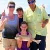 The Moore Family of Buna, TX gives a big thumbs up for Brianna's redfish, her very first.