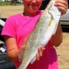 Kayla DeYoung of Winnie, TX hefts this 23-inch, 5-lb speck her Dakota brother caught
