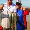 Mark and Darene Keen of Silsbee, TX waded the surf with trout catchers to nab these nice specks