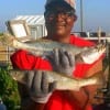 Night-shift angler Wilbert King of Humble TX free-lined live shrimp for these two nice trout