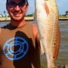 Austin Romero of Nederland TX caught this 23 inch slot red on cut mullet