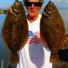Barbara Singleton of Winnie TX put these two nice flounder in the box by fishing finger mullet