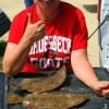 Buffalo TX angler Dot Kilgore gives a thumbs up for these nice flounder caught on finger mullet and berkley gulp