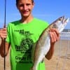 Cade Warnke of Crosby TX hefts this nice 24 inch speck caught on a live croaker