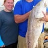 Cody and Whitney Holt of Porter TX Bulldogged this HUGE 45 inch tagger bull red while fishing a finger mullet