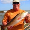 David Reed of Tomball TX fished with squid to catch this 24inch slot red