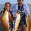 Godmother and Daughter, Mama D. and Tracy Amos heft their 3 slot redfish caught on shrimp