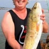 Kim Blaschke of Flint TX landed her very first redfish, a 24inch slot-red, while fishing a finger mullet