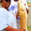 Leonard and Sybil Fields teamed up to catch this 27 inch slot red on BOTH their lines - incredible!!