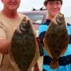 Mike Keen of Silsbee and Branden Coats of Koontz wade-fished rollover bay with Berkley Gulp for these nice flounder