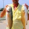 Mike White of Dayton TX took these two slot reds on live croaker