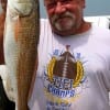 Mr Stucky of Dayton TX shows off this nice slot red caught on a live finger mullet