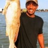 Reggie Cook of Liberty TX caught this 24 inch slot red on shrimp