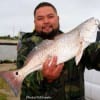 Robert Martinez of Houston caught this 24 inch slot red on shrimp