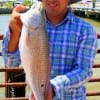 Rolando Bonillia of Houston latched onto this 22 inch slot red fishing a live croaker
