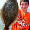 Tony McGowan of Vidor TX hefts this nice flounder caught on a mud minnow