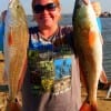 Whitney Holt of Porter TX took these 25 and 22inch slot reds on finger mullet