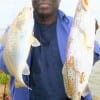 Claude Thomas of Houston caught this nice bull croaker and speck on cut mullet