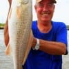 Glen Bolton of Shelbyville TX wrangled up this nice 23inch slot red on a finger mullet