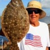 It's 21 inches - stated happy flounder pounder Barbara Singleton of Winnie- and I caught it on a finger mullet