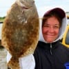 Jennifer Harrity of Santa Fe TX nabbed this nice flounder while fishing a finger mullet