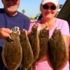 Linney and Adrian Gurganis of Tyler TX took this nice limit of 5 flounder on mud minnows and Berkley Gulp