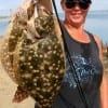 Nancy Talley of Port Bolivar TX nabbed these two nice flatfish while draggin' a Berkley Gulp